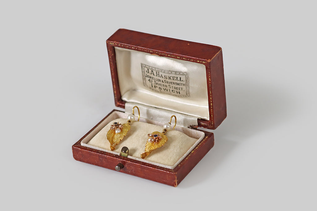 Antique Jewelry Portland, Vintage Jewelry Portland , Antique Engagement Rings | Poor Mouchette | A pair of antique, Victorian-era earrings, each modeled in 14k gold as a curling leaf, upon which a small housefly rests. These leaves are gracefully and realistically rendered, with bright-line veins and fine all-over stippling that communicates a leaf's delicate, celled texture.