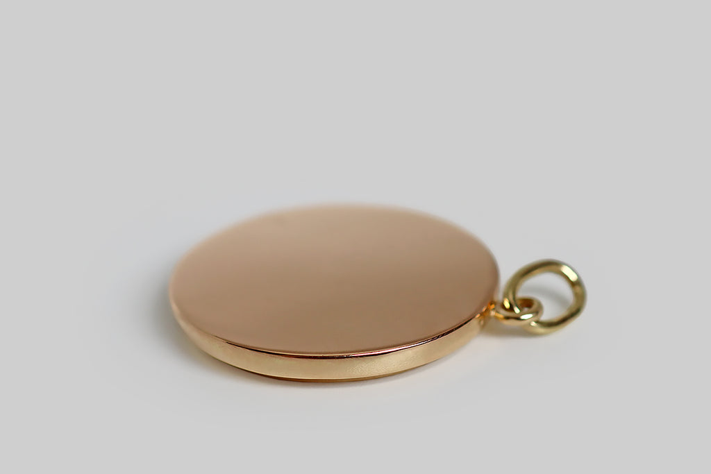 Poor Mouchette | Curated Antique Jewelry, Vintage Jewelry & Engagement Rings | Portland, Oregon | A wonderful Victorian-era pendant, modeled in 14k rose gold, whose unusual, hand-engraved subject (a sweet-faced butterfly) rests at center, surrounded by a notched border. Our butterfly’s angular, scallop-edged wings are inlaid with slabs of white, gold-bearing quartz, whose figuring insinuates a patterned butterfly wing. His forelegs are up-stretched, alongside his antenna, and his gaze is also cast upwards
