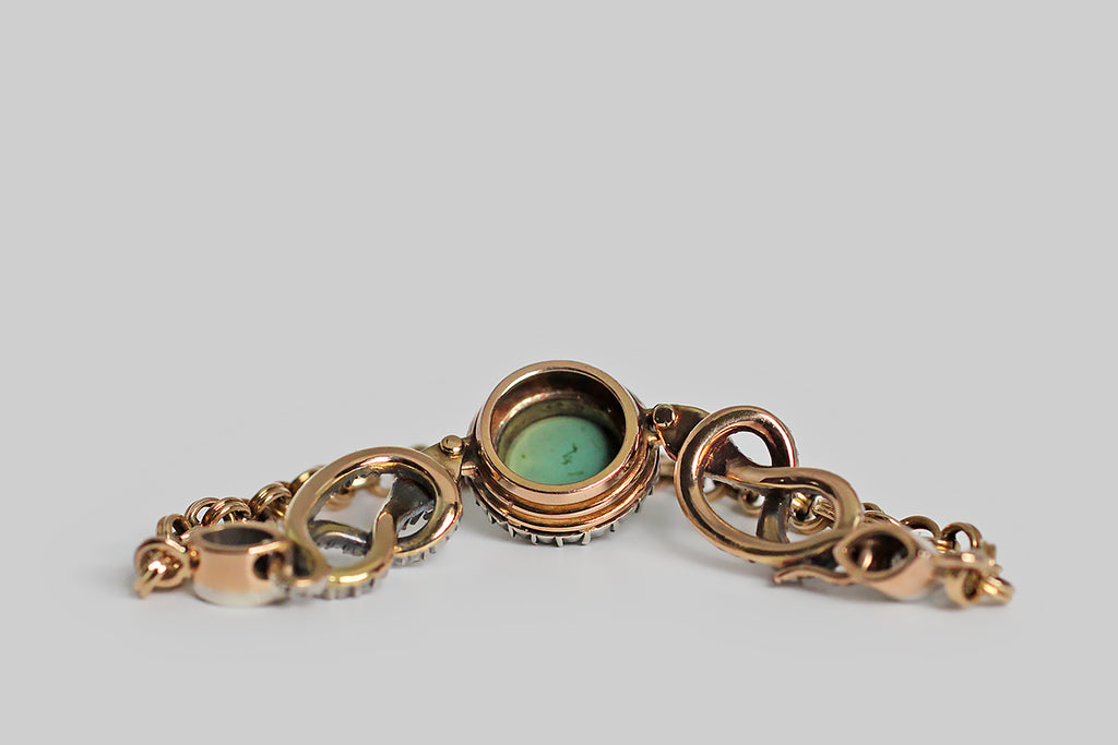 Poor Mouchette | Curated Antique Jewelry, Vintage Jewelry & Engagement Rings | Portland, Oregon | A very special Victorian-era bracelet, modeled in 14k gold with a silver top, featuring a pair of snakes (each coiled into an infinity shape) that guard a central, round, turquoise cabochon. This blue-green gem is mounted in a gold bezel, where it is haloed by a bevy of glinting rose cut diamonds— the diamonds are held in silver, cut-down collet settings.