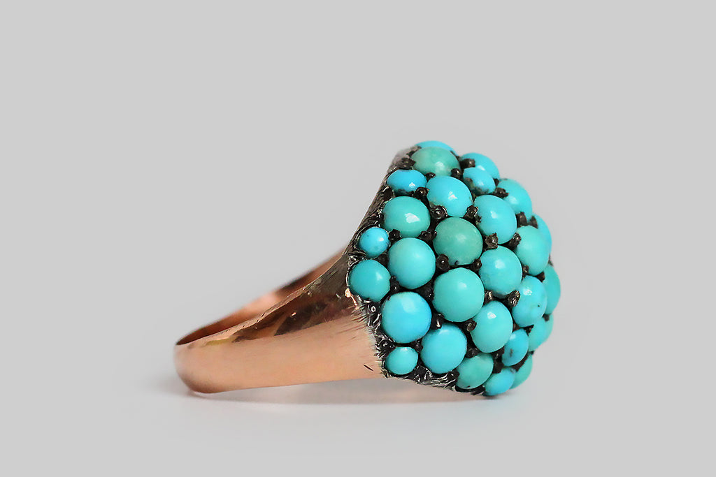 Poor Mouchette | Curated Antique Jewelry, Vintage Jewelry & Engagement Rings | Portland, Oregon | A wonderful, Victorian era bombé ring, pavé-set with fifty-three natural turquoise cabochons. These variegated, blue-green, turquoise gems are held in place by charming, irregular beads that retain their time-won, blackened patina. The ring's silver head is backed by a 10k rose gold sleeve, and its heavy, half-round shank is also fabricated in 10k rose gold. This ring is an extra-large
