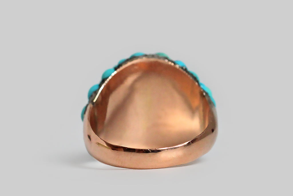 Poor Mouchette | Curated Antique Jewelry, Vintage Jewelry & Engagement Rings | Portland, Oregon | A wonderful, Victorian era bombé ring, pavé-set with fifty-three natural turquoise cabochons. These variegated, blue-green, turquoise gems are held in place by charming, irregular beads that retain their time-won, blackened patina. The ring's silver head is backed by a 10k rose gold sleeve, and its heavy, half-round shank is also fabricated in 10k rose gold. This ring is an extra-large
